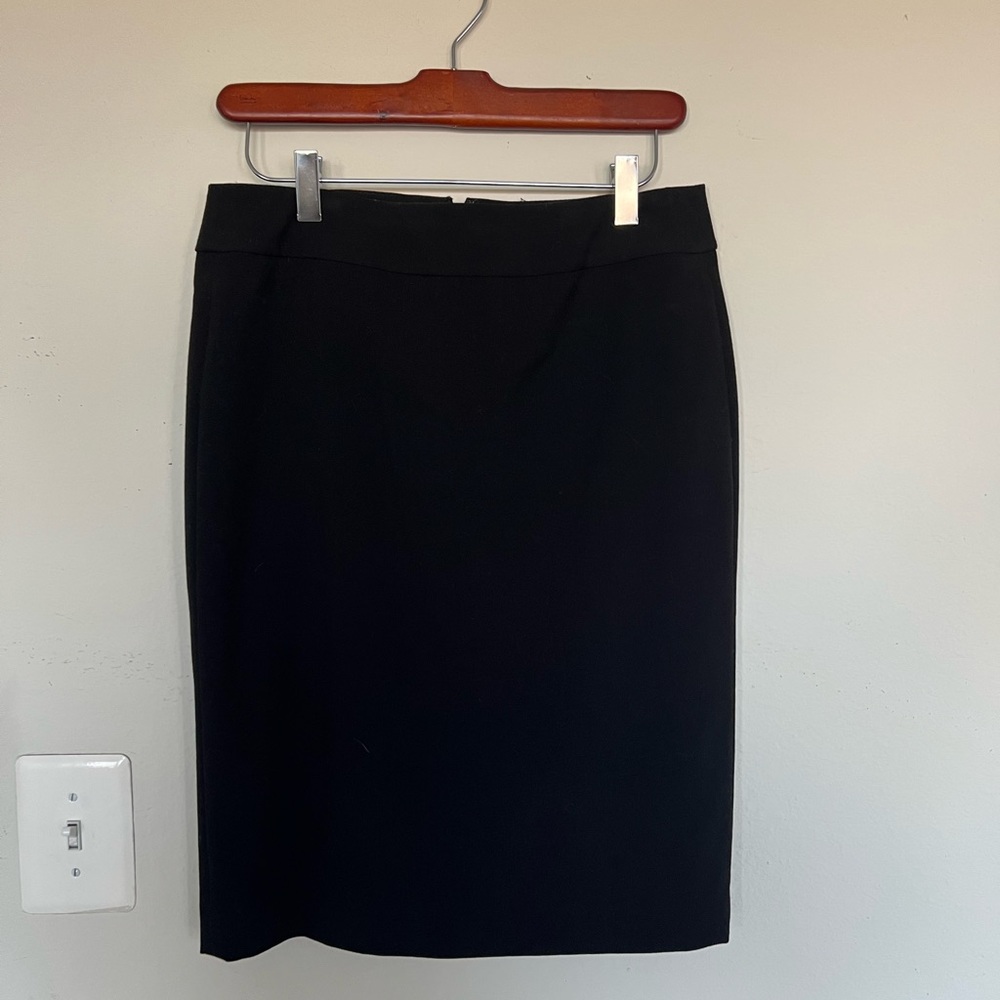 Black fitted pencil skirt. Size 4